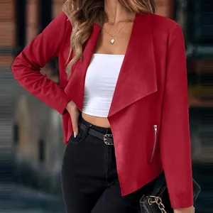 Detailed view of women's red faux suede blazer with wide lapel and zipper pocket accents