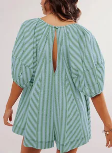 Back view detail of a green striped summer romper with open back cutout design
