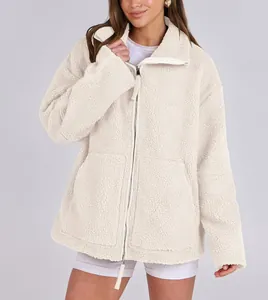 Detail view of women's oversized cream sherpa jacket with double zipper