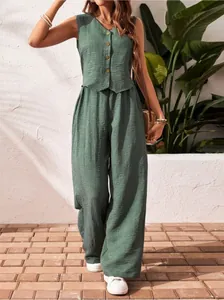 Detailed view of a sage green linen vest and wide-leg pants two-piece set on a model.