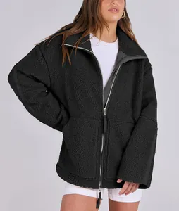 Cozy black sherpa teddy fleece jacket featuring double zippers and an oversized winter fit.