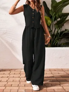 Elegant black linen two-piece set featuring a button-down V-neck vest and wide trousers.