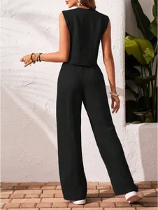 Back view of black linen sleeveless top and wide-leg trousers set with crinkle texture