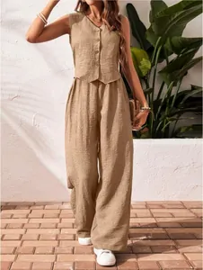 Full body view of a khaki linen vest and wide-leg trousers set in a summer setting