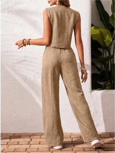 Back view showing the textured linen fabric of the casual summer vest and trousers set