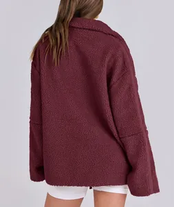 Back view of burgundy oversized teddy fleece jacket showing soft plush texture and seams