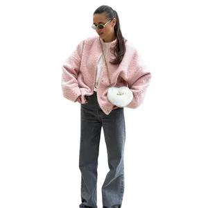 Stylish pink fuzzy teddy jacket with drop shoulders and stand collar for a casual winter look