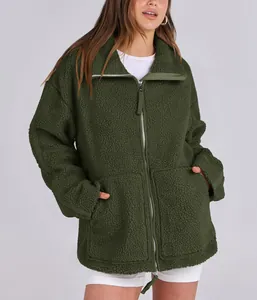 Cozy dark green oversized women's fleece teddy jacket with a functional double zipper.