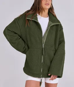 Detail view of women's oversized dark green teddy fleece jacket with double zipper closure