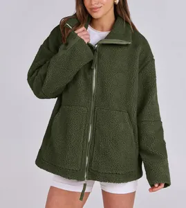 Cozy olive green oversized teddy fleece jacket with functional double zipper closure.