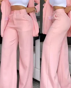 Detailed front and side view of elegant pink high-waisted trousers and blazer set
