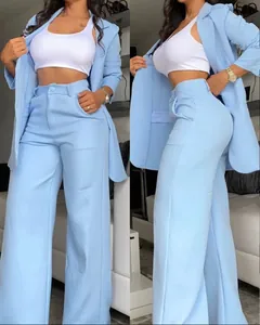 Detail view showing the elegant light blue blazer and wide-leg trousers suit for women