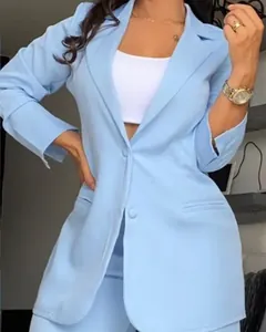 Detail of elegant light blue women's blazer with lapel and unique split sleeves design