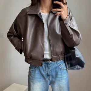 Elegant women's brown faux leather moto jacket with vintage style and zipper closure