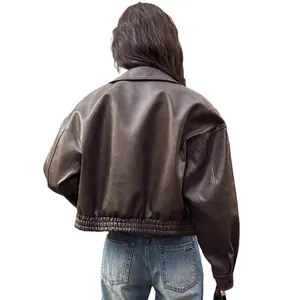Back view of women's vintage dark brown PU leather motorcycle jacket with elastic hem