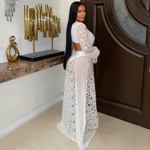 Detailed view of sexy white lace mesh long dress with high side slit