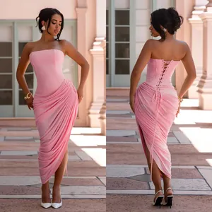 Front and back detail of a pink strapless ruched bodycon maxi dress with corset lacing