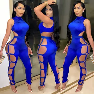 Close-up view of a sexy royal blue backless jumpsuit with side cutouts and ring details
