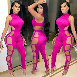Sexy hot pink cut-out jumpsuit with ring details and backless design for nightclub wear.
