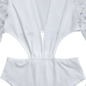 Close-up of white sexy deep V-neck dress with lace sleeves and cutout details.