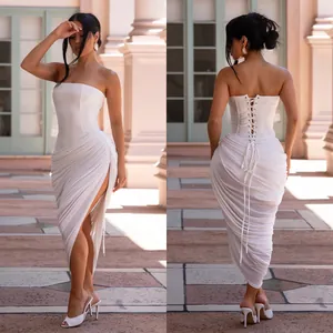 Front and back detail of white strapless ruched bodycon dress with lace-up back