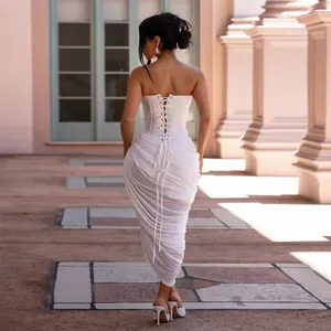 Back view of sexy white strapless ruched bodycon maxi dress with corset lace-up detailing