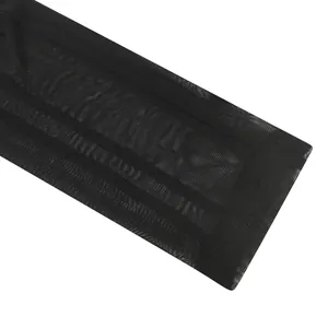 Macro view of high-quality black mesh fabric hem for a sheer two-piece apparel set
