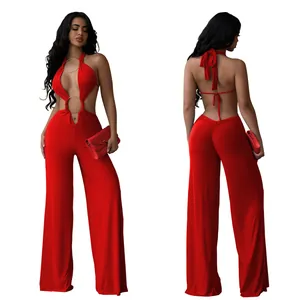 Detailed view of a sexy red backless halter jumpsuit featuring front metal ring and wide legs