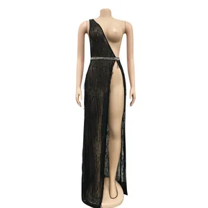 Detail view of sexy black sequined mesh dress with high slit and rhinestone belt.