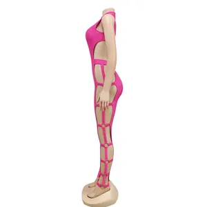 Detailed side view of a vibrant pink sexy hollow-out jumpsuit featuring metal ring accents