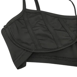 Close-up showing the high-quality stitching and fabric texture of the black top