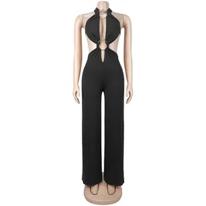 Detailed view of sexy black jumpsuit featuring gold ring accents and halter neck design