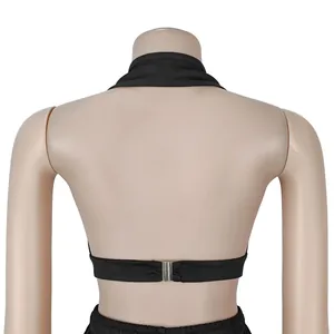 Detailed back view of a black halter top featuring a secure silver metal buckle
