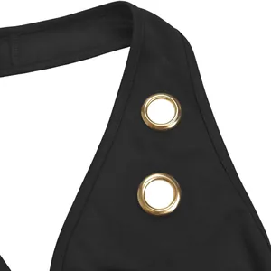 Detailed close-up of premium gold eyelets and black fabric on stylish women's clothing.