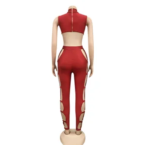Rear view of a sexy red hollow-out nightclub jumpsuit on a professional mannequin