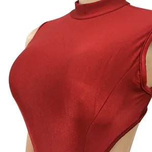 Detail of a red high-neck sleeveless bodysuit showing its shiny, stretchy fabric texture
