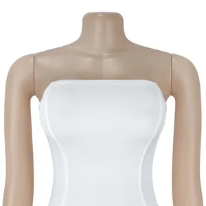 Detail of white off-the-shoulder tube top dress showing elastic textured fabric
