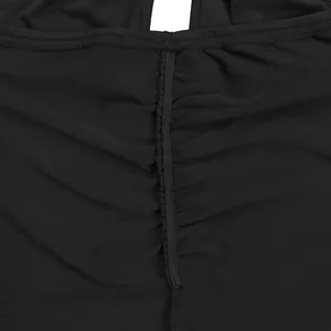 Macro detail showing the ruched fabric texture of a sexy black backless jumpsuit