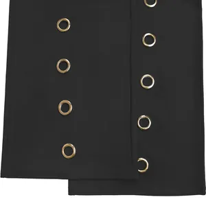 Close-up macro detail of golden metal grommets on stylish black wide leg fashion trousers