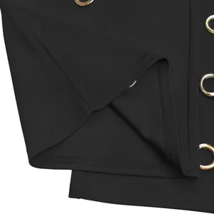 Close-up detail of black wide-leg pants featuring premium gold-tone metal grommets.