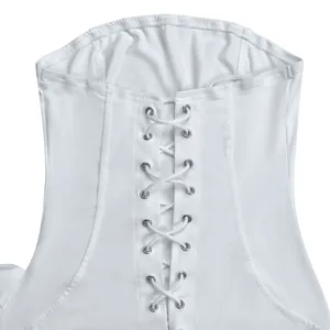 Detailed close-up view of a white lace-up tube dress featuring silver metal eyelets