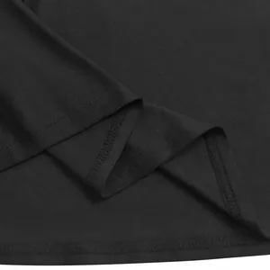 Macro view of high-quality black stretch fabric and durable double-stitch hem of a bodycon dress