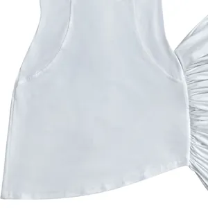 Close-up detail of a white pleated bodycon dress featuring a functional side pocket and ruffles