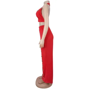 Side view of red two-piece set featuring crop top and eyelet wide-leg trousers
