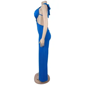 Side view showing the detailed halter neck and backless design of a blue jumpsuit
