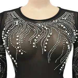 Close-up detail of sexy black mesh sheer clubwear dress featuring pearls and rhinestones