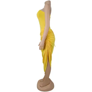 Side view of yellow ruched strapless bodycon dress showing draped detail and slit