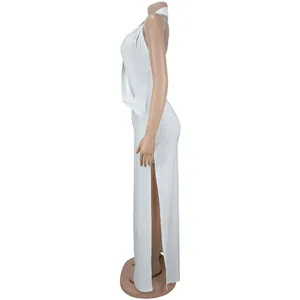 Side view of elegant white halter neck backless maxi dress with a high side slit.