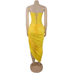 Sexy back view of yellow strapless ruched maxi dress with lace-up corset detail.