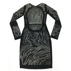Detailed view of black mesh see-through mini dress with rhinestone patterns and open back